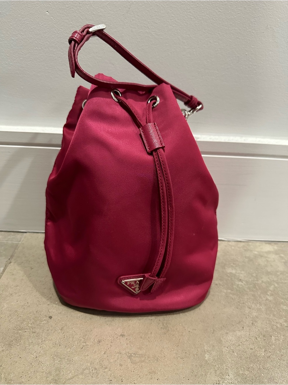 Prada nylon raspberry pink drawstring mini bucket bag with wristlet